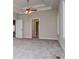 A primary bedroom features a ceiling fan, tray ceiling, and neutral carpeting at 5995 Azalea Ridge Dr, Douglasville, GA 30135