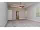 A primary bedroom features a ceiling fan, tray ceiling, and neutral carpeting at 5995 Azalea Ridge Dr, Douglasville, GA 30135