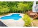 Inviting in-ground pool with a spacious concrete deck, perfect for summer fun and relaxation at 5995 Azalea Ridge Dr, Douglasville, GA 30135