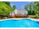 Inviting backyard pool with a spacious deck and patio, ideal for summer entertaining and leisure at 5995 Azalea Ridge Dr, Douglasville, GA 30135