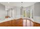 Inviting dining room showcasing hardwood floors and a chandelier, perfect for entertaining guests at 7165 Jonsway, Cumming, GA 30041