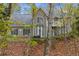 Charming two-story home featuring a well-maintained lawn and inviting front entrance at 7165 Jonsway, Cumming, GA 30041