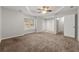 Spacious Primary bedroom with a tray ceiling, and a door to the outside deck at 7165 Jonsway, Cumming, GA 30041