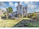 Backyard with a spacious deck, a pergola, and lush landscaping, perfect for outdoor living at , Suwanee, GA 30024