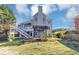 Backyard with a spacious deck, a pergola, and lush landscaping, perfect for outdoor living at , Suwanee, GA 30024