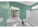 Clean bathroom with white tile, a tub, toilet, and vanity at , Suwanee, GA 30024
