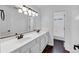 Bathroom featuring a dual sink vanity with tile floor at , Suwanee, GA 30024