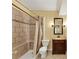 Full bathroom featuring a tiled shower, and vanity with a dark wood cabinet at , Suwanee, GA 30024