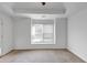 A well-lit room with tray ceiling and window at , Suwanee, GA 30024