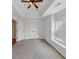 Bedroom features ceiling fan, tray ceiling, and window at , Suwanee, GA 30024