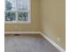 Cozy bedroom with soft carpet, neutral walls, and a bright window at , Suwanee, GA 30024