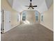 Spacious bedroom features a tray ceiling, fan, and multiple windows at , Suwanee, GA 30024