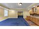 Bonus room featuring a wet bar with lots of cabinetry, recessed lights, and access to the exterior at , Suwanee, GA 30024