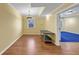 Bonus room with laminate flooring, yellow walls, and a window with natural light at , Suwanee, GA 30024
