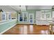 Bright dining area with hardwood floors, a view to the deck, and an open layout with white kitchen cabinets at , Suwanee, GA 30024
