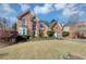 Charming two-story brick home featuring an attached two-car garage, driveway and landscaping at , Suwanee, GA 30024
