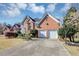 Charming two-story brick home featuring an attached two-car garage, long driveway and landscaping at , Suwanee, GA 30024