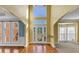 Spacious front entry foyer with high ceilings, hardwood floors, and leaded glass door at , Suwanee, GA 30024