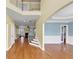 View from the foyer showing the stairway, hardwood floors, and entrance to the living room at , Suwanee, GA 30024