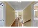 Upstairs hallway with hardwood floors, white trim, and natural light at , Suwanee, GA 30024