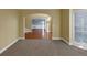 View from the living room showcasing the archway, carpeted flooring, and neutral wall colors at , Suwanee, GA 30024