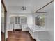 Bright main bathroom showcasing wood look floors, a chandelier, separate tub, and a glass enclosed shower at , Suwanee, GA 30024