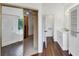 Main bathroom showcasing wood look floors, dual vanities, walk-in closet, and a glass enclosed shower at , Suwanee, GA 30024