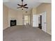 Large main bedroom featuring a black fireplace with a white mantle and access to the main bathroom at , Suwanee, GA 30024