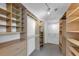 Spacious walk-in closet with custom shelving and racks providing ample storage space at , Suwanee, GA 30024