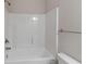 Bathroom with white shower-tub combo with brushed nickel fixtures at 310 Ashigan St, Union City, GA 30291
