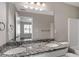 Bathroom featuring double sinks, granite countertops and a large framed mirror at 310 Ashigan St, Union City, GA 30291