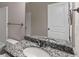 Bathroom featuring granite counters, framed mirror and neutral walls at 310 Ashigan St, Union City, GA 30291