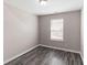 Bedroom with wood-look flooring, natural light and neutral walls at 310 Ashigan St, Union City, GA 30291