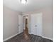 Bedroom featuring wood-look flooring and a closet with double doors at 310 Ashigan St, Union City, GA 30291