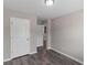 A bedroom with wood-look flooring and a closet with double doors at 310 Ashigan St, Union City, GA 30291