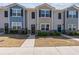 Charming townhomes featuring modern exteriors with landscaped front yards and inviting entryways at 310 Ashigan St, Union City, GA 30291