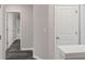 Hallway showing access to a bathroom, bedroom, and storage at 310 Ashigan St, Union City, GA 30291