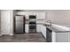 Modern kitchen with stainless steel appliances, granite countertops, and white cabinetry at 310 Ashigan St, Union City, GA 30291