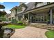 A large outdoor patio area with seating and a built-in grill, perfect for entertaining in a private backyard setting at 5119 Greythorne Ln, Marietta, GA 30068