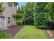 Spacious backyard with manicured lawn and privacy landscaping, creating a tranquil outdoor oasis with mature trees at 5119 Greythorne Ln, Marietta, GA 30068