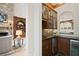 Wet bar area with stone fireplace and bar refrigerator at 5119 Greythorne Ln, Marietta, GA 30068