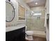 Modern bathroom with a glass-enclosed shower, granite countertop vanity, and sleek fixtures for a spa-like experience at 5119 Greythorne Ln, Marietta, GA 30068