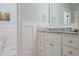 Bright bathroom featuring white cabinets with granite countertop and grey-blue wall paint at 5119 Greythorne Ln, Marietta, GA 30068