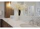 Luxurious bathroom countertop with dual sinks, modern fixtures, and stylish tile backsplash at 5119 Greythorne Ln, Marietta, GA 30068