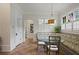 Bright breakfast nook with cushioned seating, a glass table, and lots of natural light from large windows at 5119 Greythorne Ln, Marietta, GA 30068