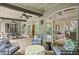 Relax on the covered patio with comfortable lounge chairs and a view of the home's interior at 5119 Greythorne Ln, Marietta, GA 30068
