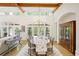 Bright dining room featuring hardwood floors, wood beams, and a large chandelier at 5119 Greythorne Ln, Marietta, GA 30068