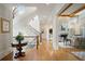 Elegant hallway with a spiral staircase leading to an adjacent living area, showcasing the home's design at 5119 Greythorne Ln, Marietta, GA 30068