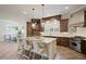 Bright, open kitchen with granite countertops, stainless steel appliances, and a large center island with seating at 5119 Greythorne Ln, Marietta, GA 30068
