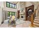 Cozy living room with a stone fireplace, wood beams, and large windows at 5119 Greythorne Ln, Marietta, GA 30068